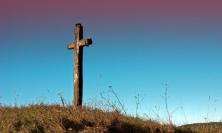 Cross standing on hill