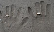 Handprints in sand