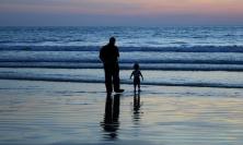 Photo of father & child on beach