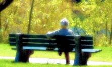 Photo of woman on bench by Grant MacDonald at flickr.com