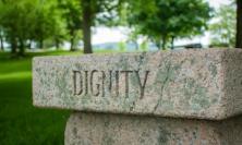 Photo of plinth saying 'Dignity' by Dave Lowe via Unsplash