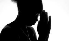 Photo of woman praying by Adegbenro Emmanuel Dipo on Unsplash